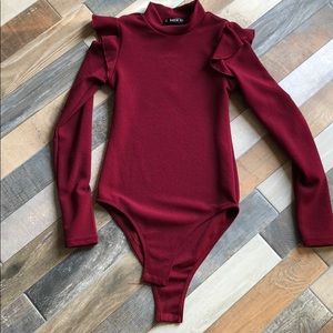 Wine colored long sleeve body suit.